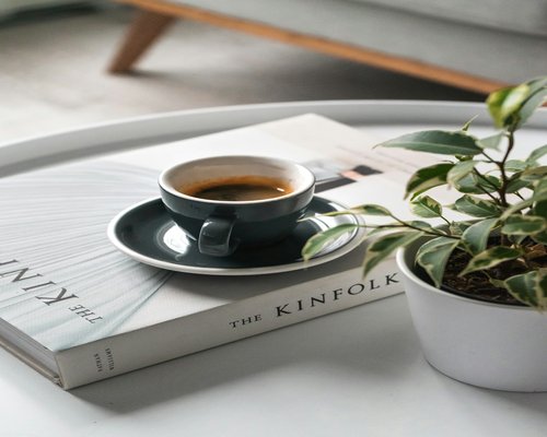 A calm weekend morning with a book and coffee at home